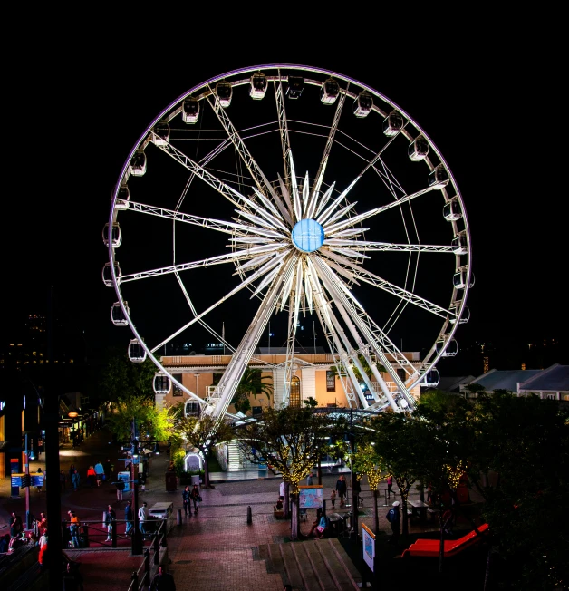 a large ferris wheel sitting in the middle of a city, in front of a black background, square, bay area, a phoenix