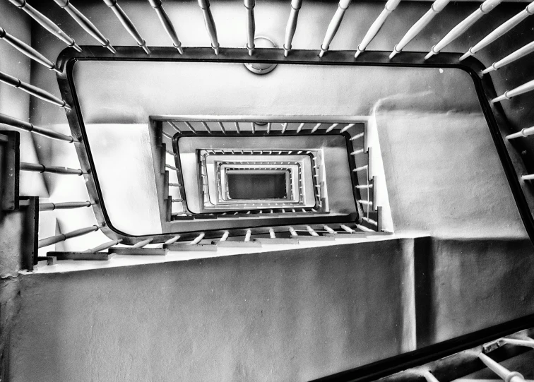 a black and white photo of a spiral staircase, a black and white photo, inspired by André Kertész, pexels, art nouveau, square, eyelevel!!! view!!! photography, photo on iphone, bauhaus art