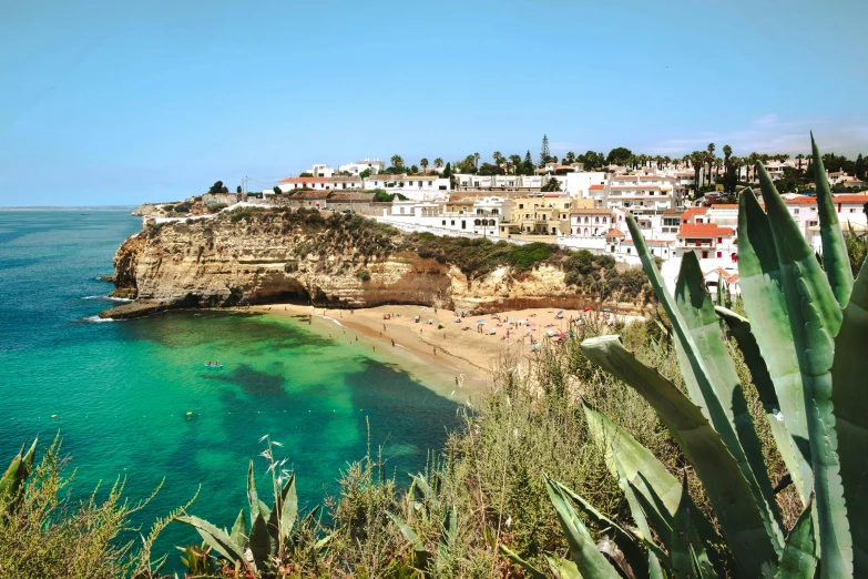 a large body of water next to a beach, pexels contest winner, renaissance, the village on the cliff, rocha, promo image, travel guide