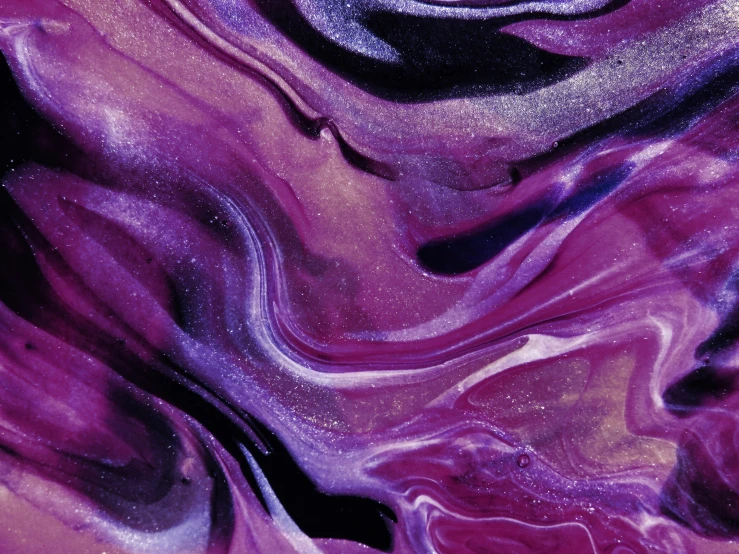 a close up of a purple and black painting