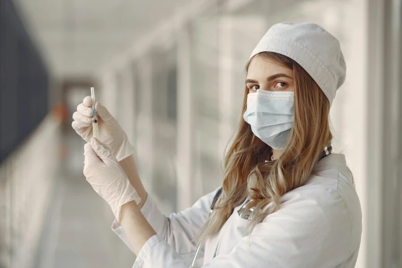 a close up of a person wearing a mask and gloves, holding a syringe, nurse girl, avatar image, college