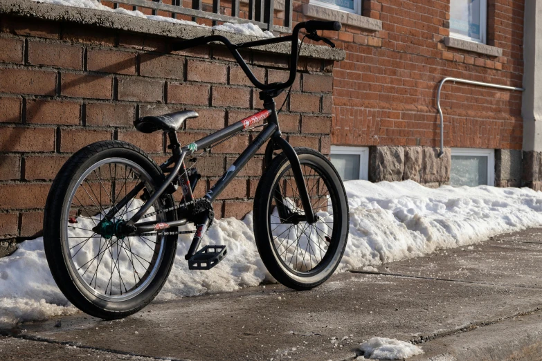 a bicycle parked in front of a brick building, skate park, chesley, profile picture, 2 0 2 4