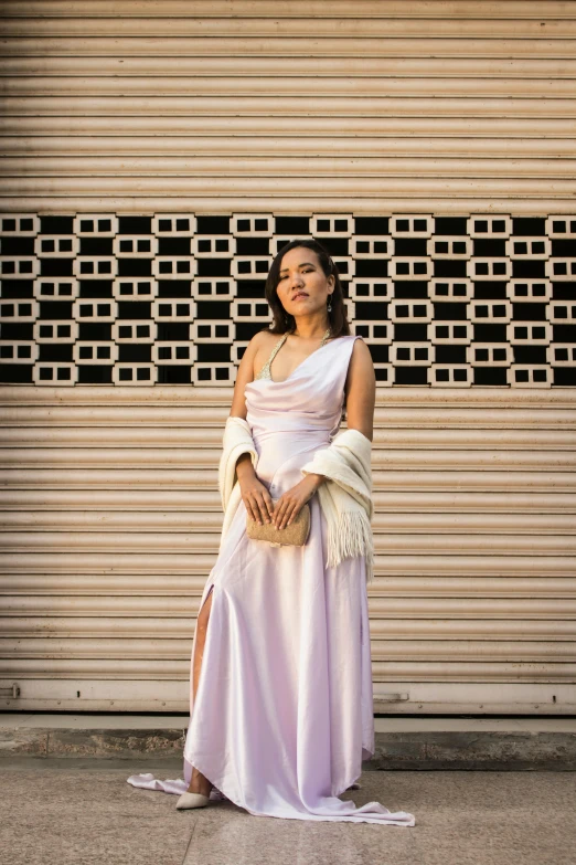 a woman standing in front of a garage door, by William Berra, unsplash, renaissance, wearing an evening gown, lavender blush, isabela moner, asian woman