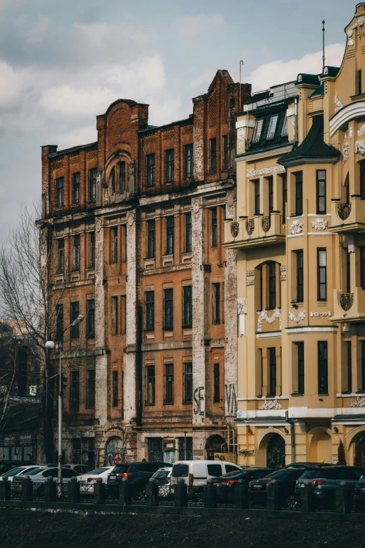 a row of buildings next to a body of water, a photo, inspired by Vasily Surikov, neoclassicism, brick building, exterior, street view, exterior shot