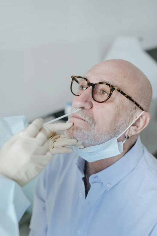 a man getting his teeth examined by a dentist, pexels contest winner, hyperrealism, square nose, white beard, pathology sample test tubes, looking serious