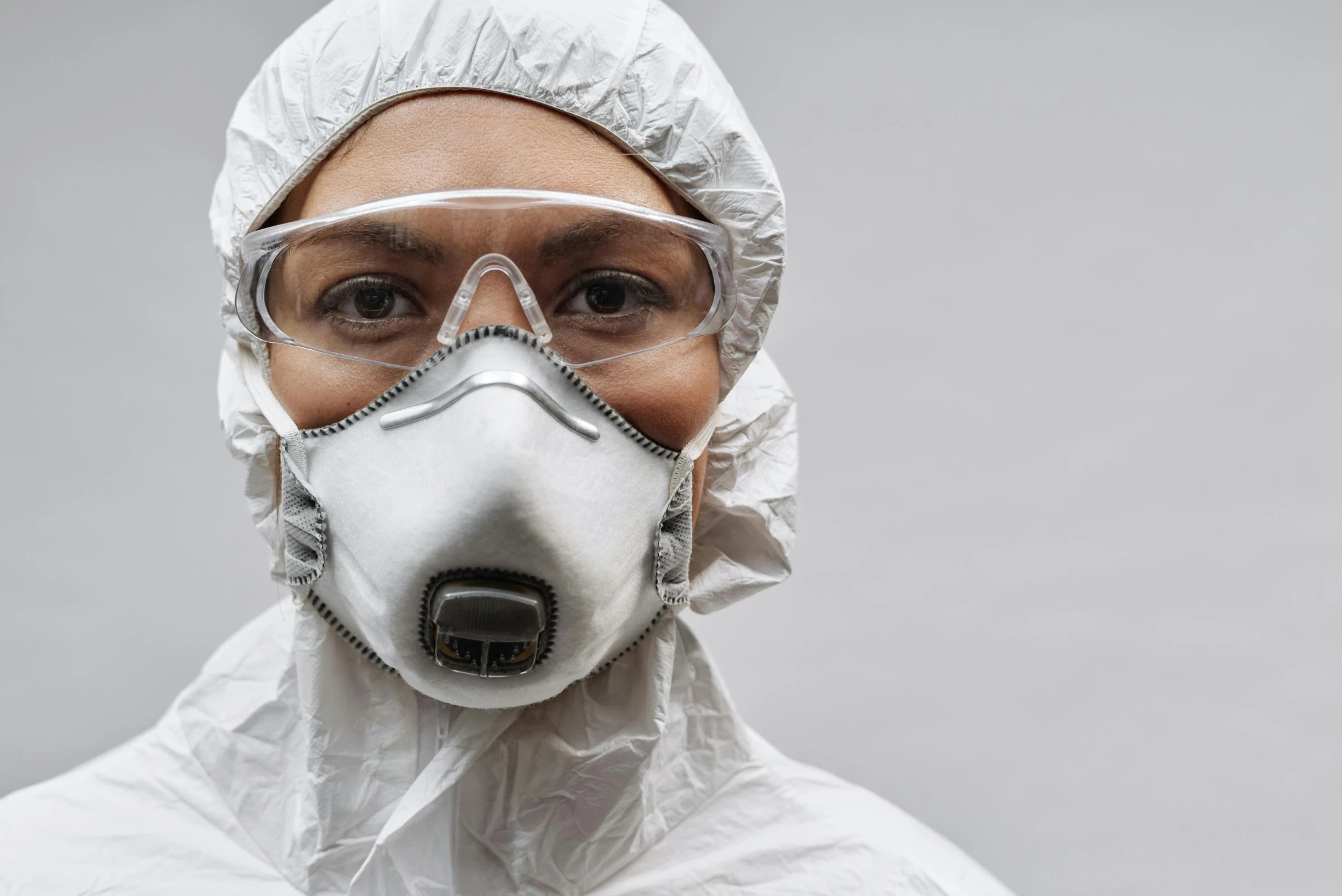 a person wearing a protective suit and goggles, pexels contest winner, plasticien, white, grey, cardboard, portrait image