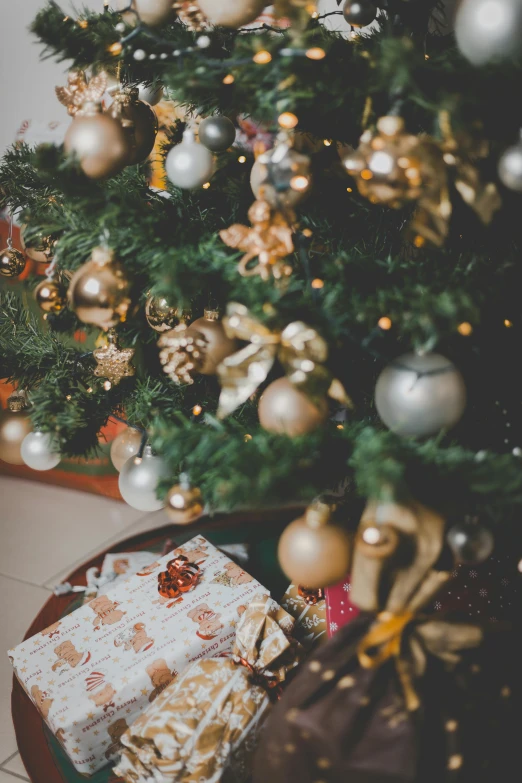 a christmas tree with presents under it, pexels, renaissance, high angle close up shot, multiple stories, thumbnail, warm light