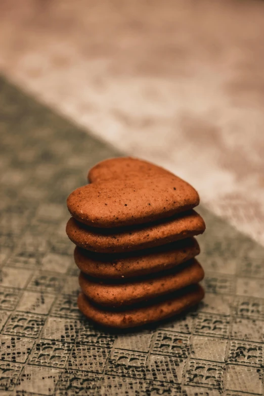 a stack of cookies sitting on top of a table, by Sebastian Spreng, pexels contest winner, hearts, 15081959 21121991 01012000 4k, rounded corners, brown resin