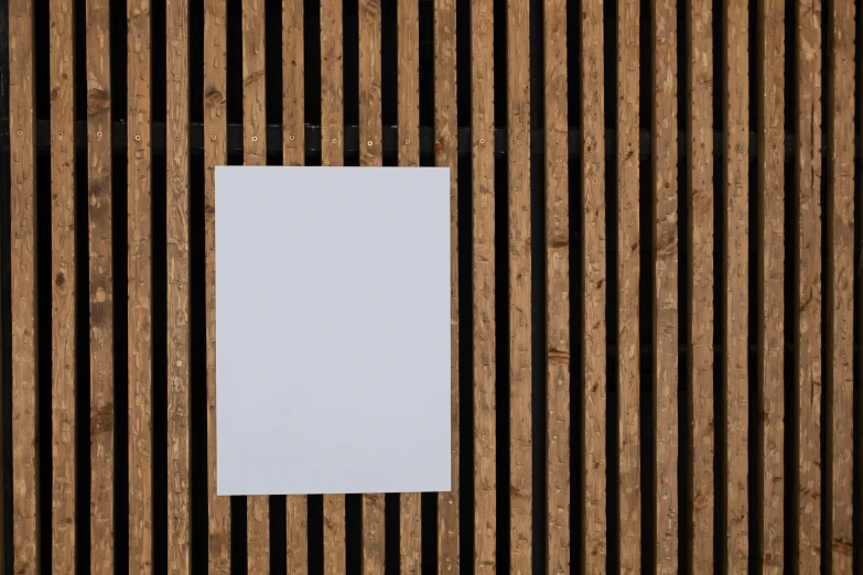 a piece of paper sitting on top of a wooden wall, by Jan Rustem, postminimalism, square lines, white, a wooden, artwork empty daylight