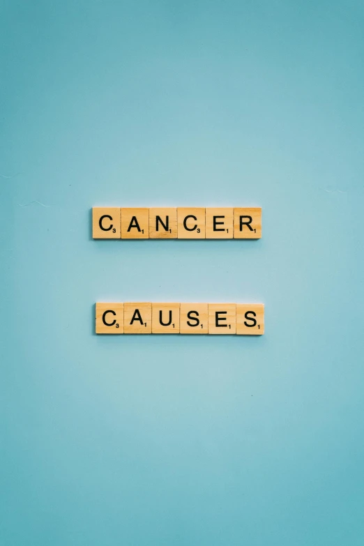 scrabbles spelling cancer and causes on a blue background, a cartoon, shutterstock, 256x256, vintage color, a green, captured on canon eos r 6