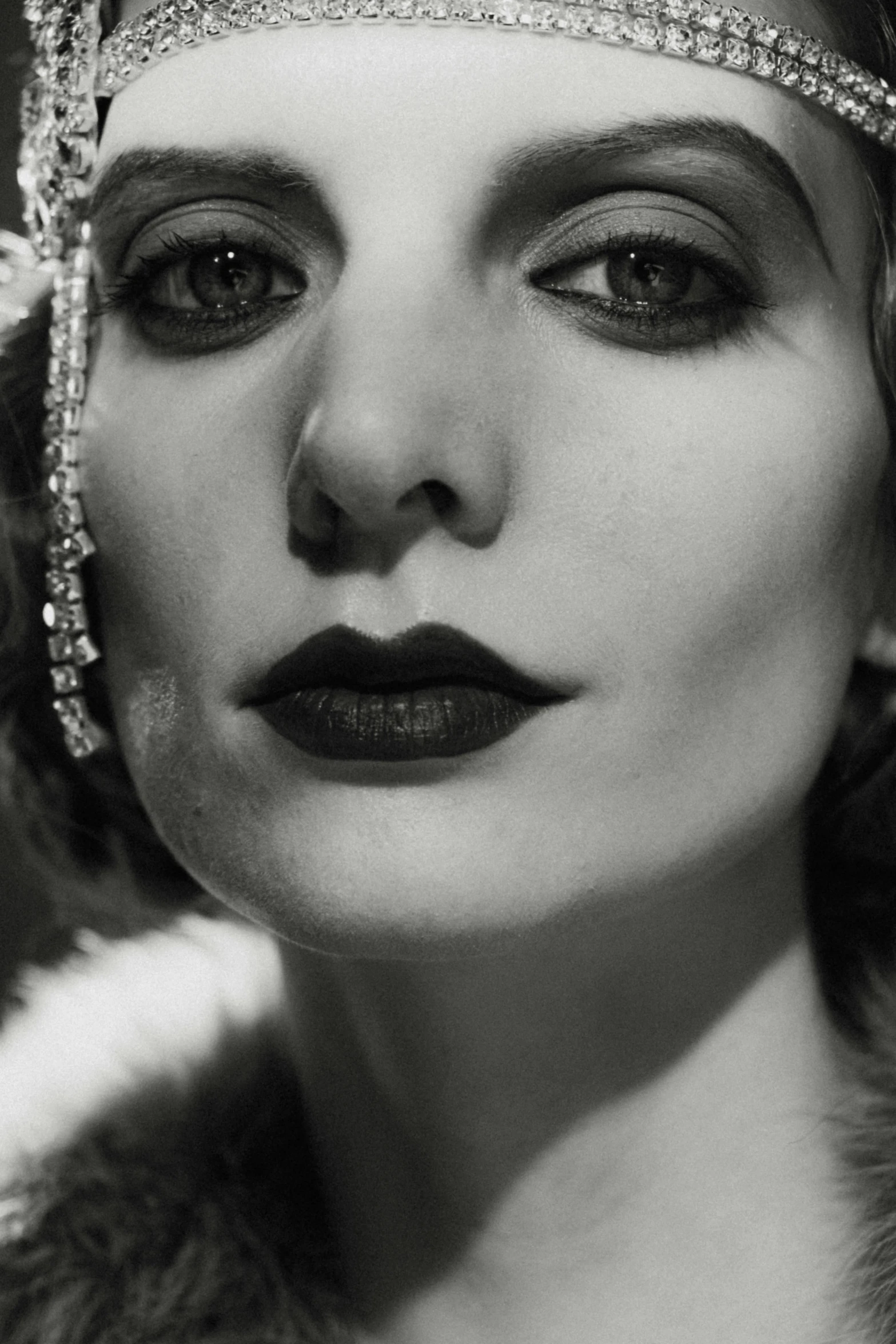 a black and white photo of a woman wearing a headpiece, inspired by George Hurrell, emma stone face, detail face, british pathe archive, bells