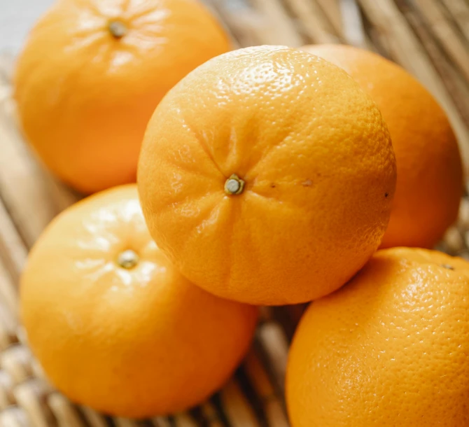 a bunch of oranges sitting on top of a table, a stipple, trending on pexels, mingei, close up of iwakura lain, thumbnail, close-up product photo, high quality product image”