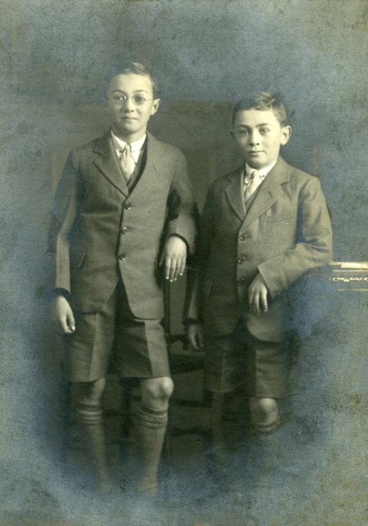 a couple of men standing next to each other, flickr, american barbizon school, young boy, promo image, portrait image, leg high