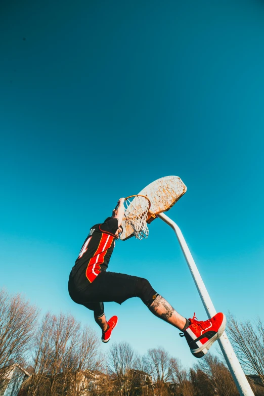 a man flying through the air while riding a skateboard, pexels contest winner, lacrosse player, holding a scythe, headshot photo, slam dunk