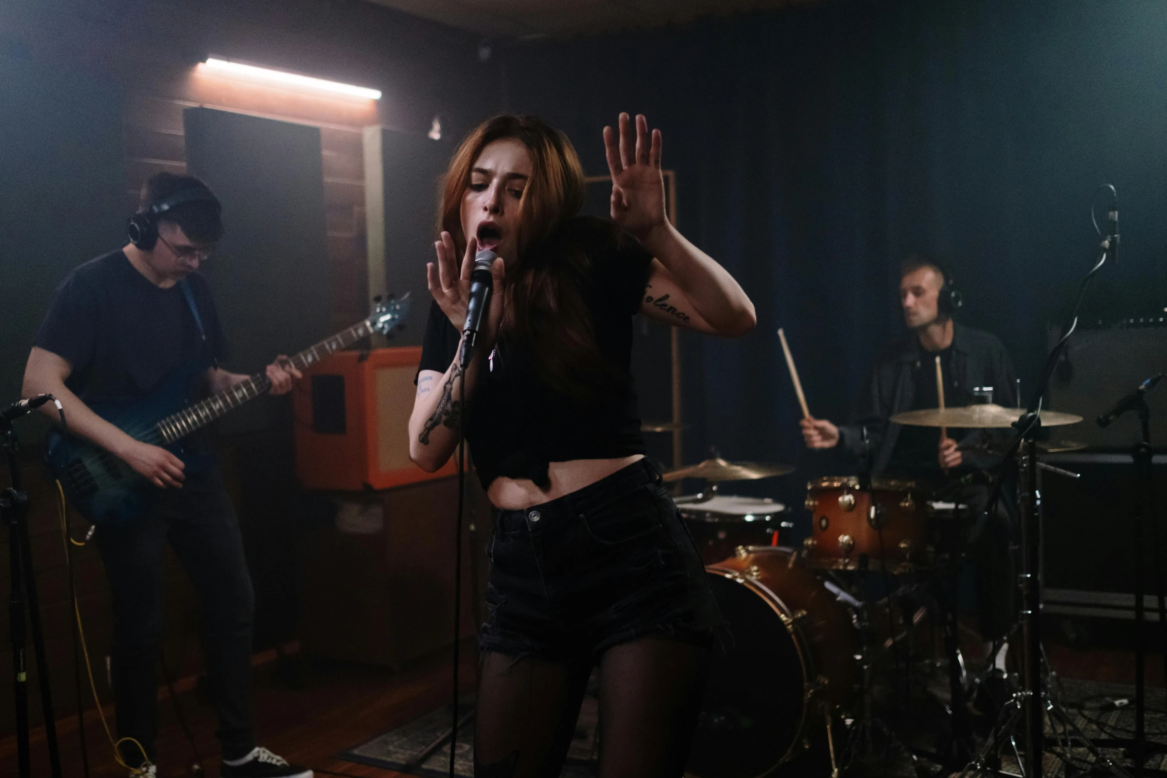 a woman that is standing in front of a microphone, an album cover, pexels contest winner, antipodeans, performing a music video, rosalia, playing drums, charli bowater and artgeem