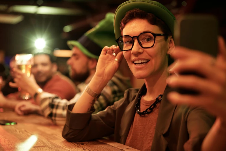 a group of people sitting around a wooden table, pexels contest winner, happening, wearing green tophat, nerds, in the pub, photo of a woman