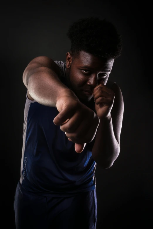 a man pointing his finger at the camera, by Maxwell Bates, athlete photography, black teenage boy, profile pic, various posed