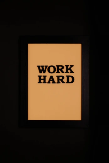 a framed picture with the words work hard on it, by Julia Pishtar, visual art, made of glowing wax and ceramic, demur, f / 3, panel