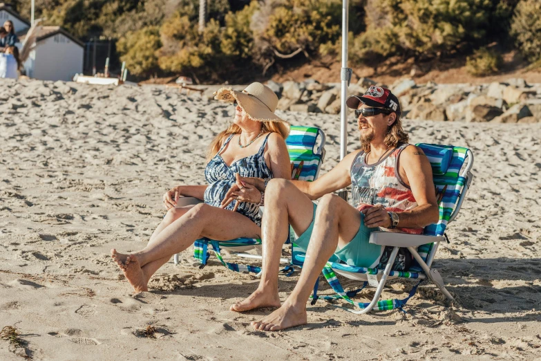 a couple of women sitting on top of a beach, in a sun lounger, profile image, lachlan bailey, older woman