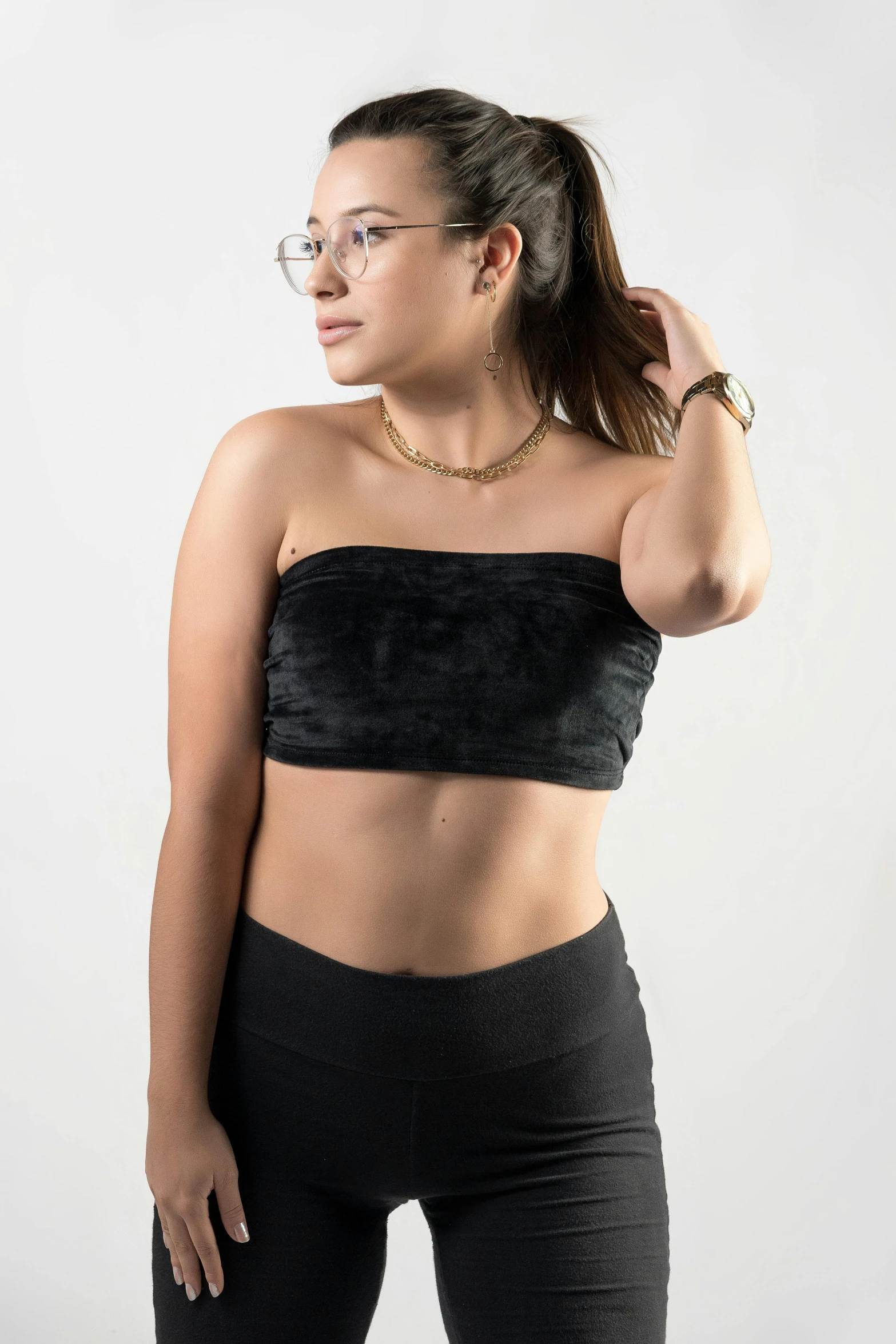 a woman in a black top and black pants, unsplash, tube-top dress, high resolution photograph, croptop and shorts, age 2 0