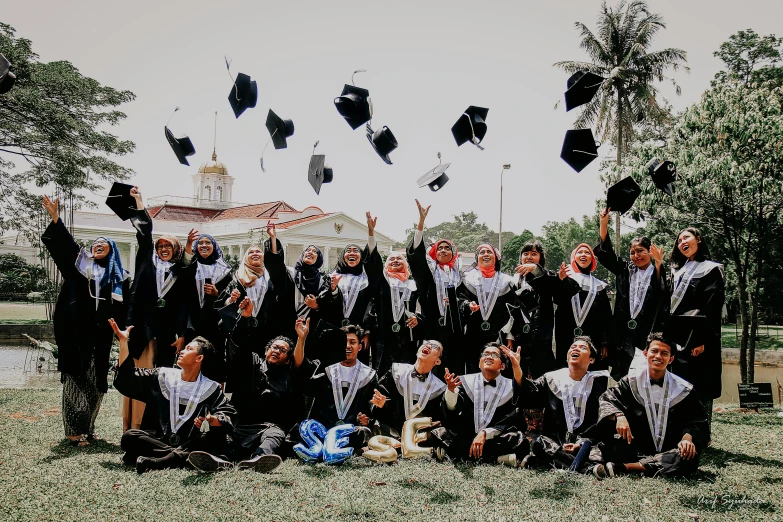 a group of people that are standing in the grass, a picture, by Bernardino Mei, pexels contest winner, academic art, graduation photo, islamic, 🚀🌈🤩, happy expression