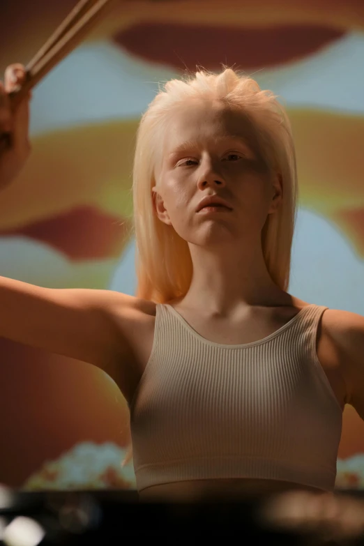 a woman in a white tank top playing drums, an album cover, inspired by Vanessa Beecroft, surrealism, albino dwarf, unreal engine : : rave makeup, silicone skin, digital sculpture