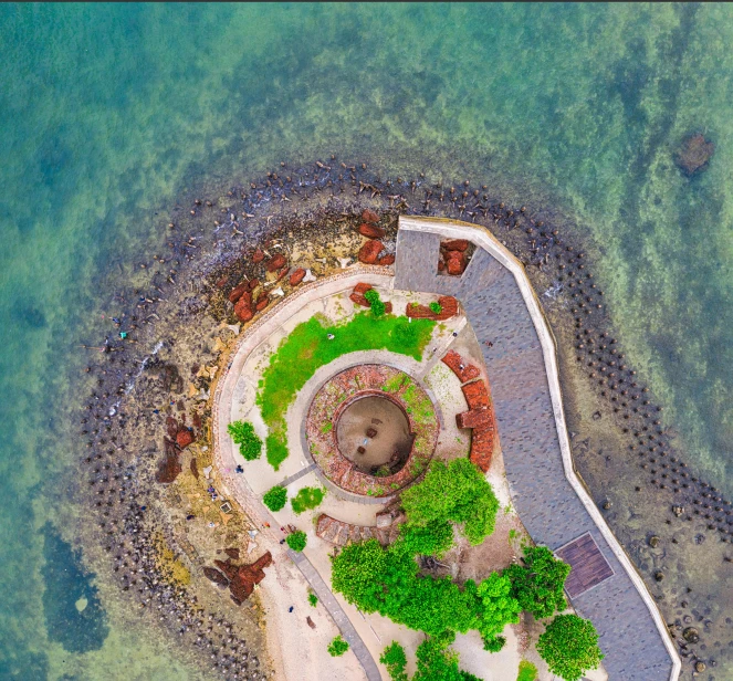 a small island in the middle of the ocean, pexels contest winner, parks and monuments, hoang lap, spiraling, post+processing