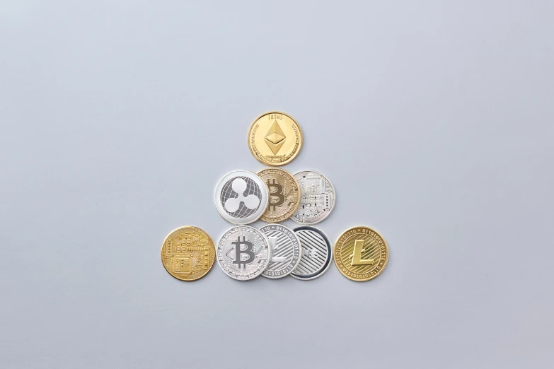 a pile of coins sitting on top of each other, edible crypto, detailed product image, triangle, gold silver