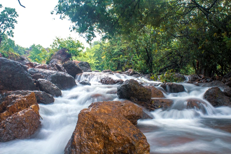 a stream running through a lush green forest, an album cover, unsplash, hurufiyya, epic khajuraho, white water rapids, thumbnail, panoramic