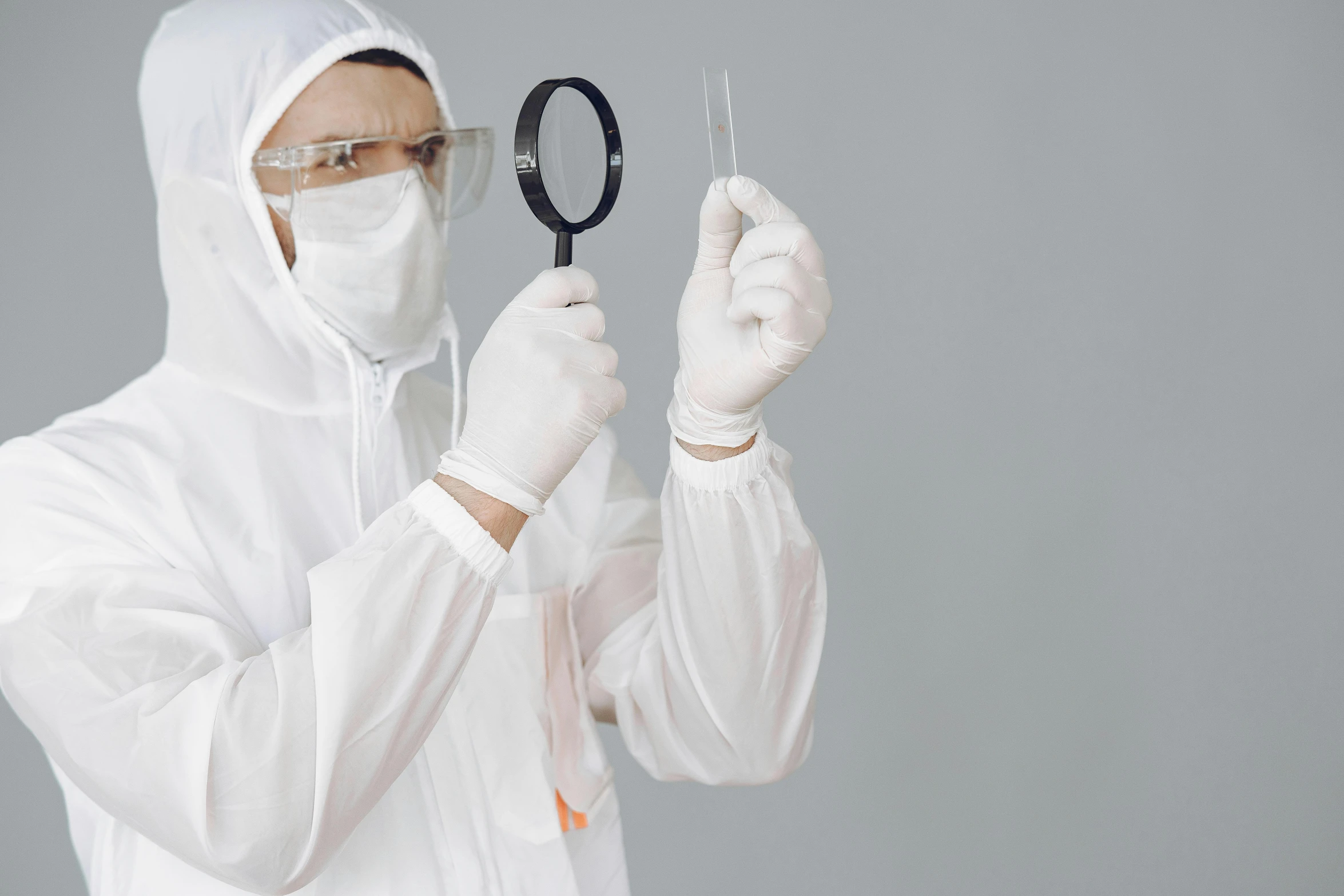 a man in a white lab coat holding a pair of scissors, pexels contest winner, analytical art, wearing translucent veils, graphene, dressed as a scavenger, white uniform
