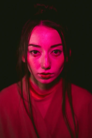 a woman with a red light on her face, a character portrait, pexels contest winner, portrait sophie mudd, vhs filter, lee madgwick & liam wong, high angle closeup portrait