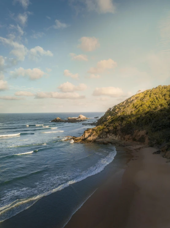 a man riding a surfboard on top of a sandy beach, trees and cliffs, gigapixel photo, quixel megascans, australian beach