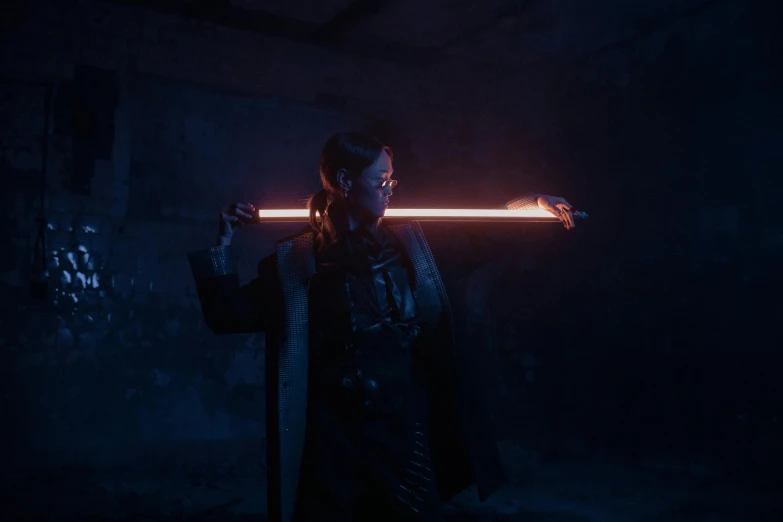 a man holding a sword in a dark room, cyberpunk art, unsplash contest winner, flares anamorphic, she is holding a long staff, ww 1 sith sorcerer, lense flares