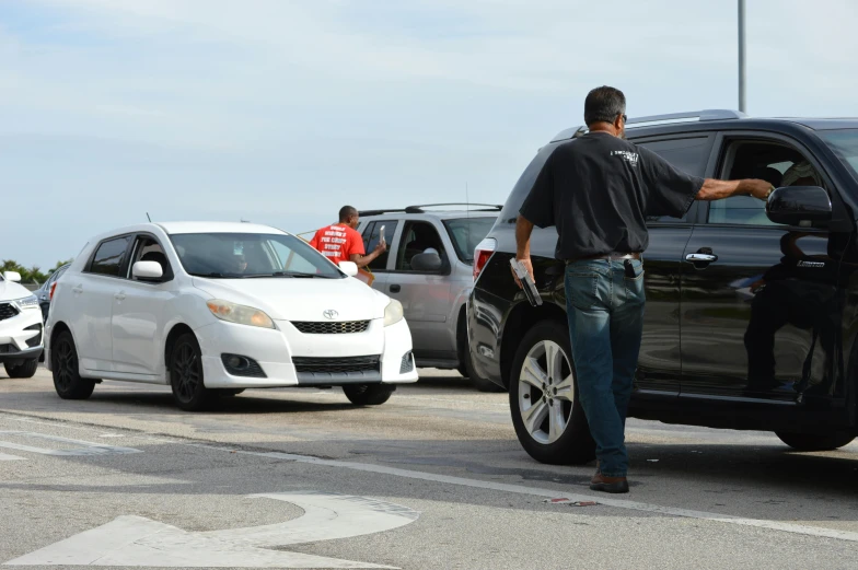 a man standing next to a car in a parking lot, happening, in line, complaints, florida man, thumbnail