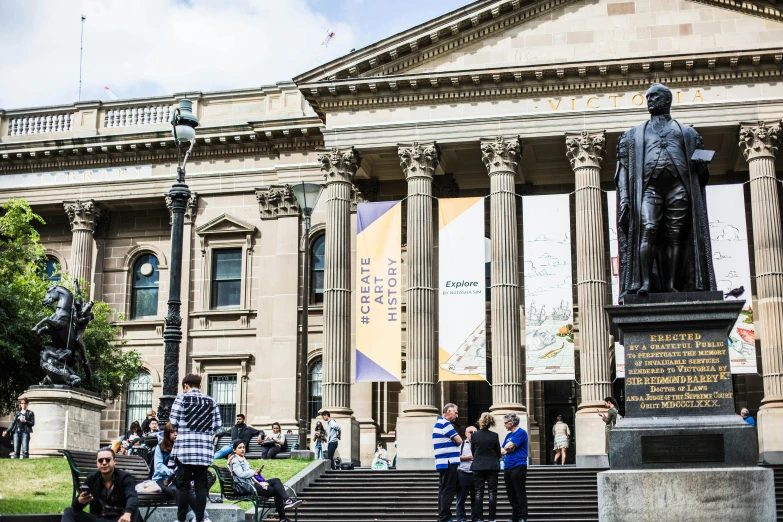 a group of people standing in front of a building, by Nicolette Macnamara, unsplash, academic art, national gallery, on a hot australian day, gigantic pillars, banner