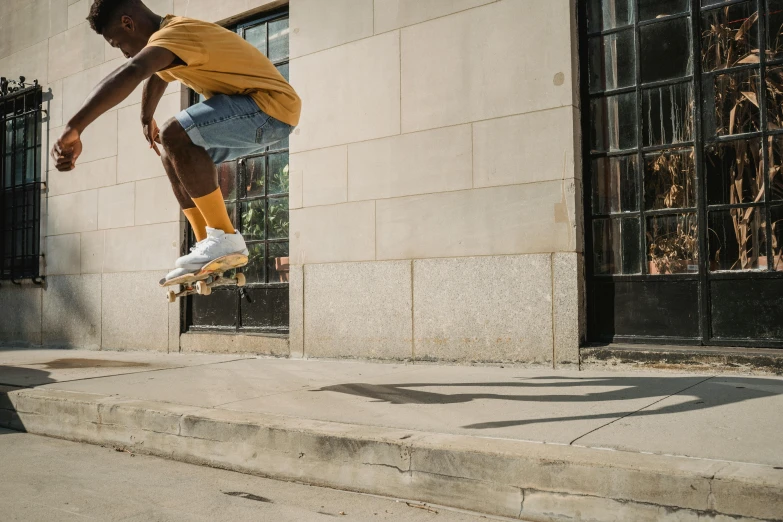 a man flying through the air while riding a skateboard, by Carey Morris, pexels contest winner, jamel shabazz, hd footage, ad image, looking off to the side