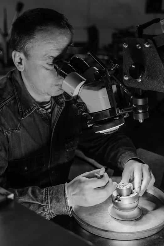 a black and white photo of a man working on a pottery, a microscopic photo, under a microscope, kirill leonov, profile picture, stitching