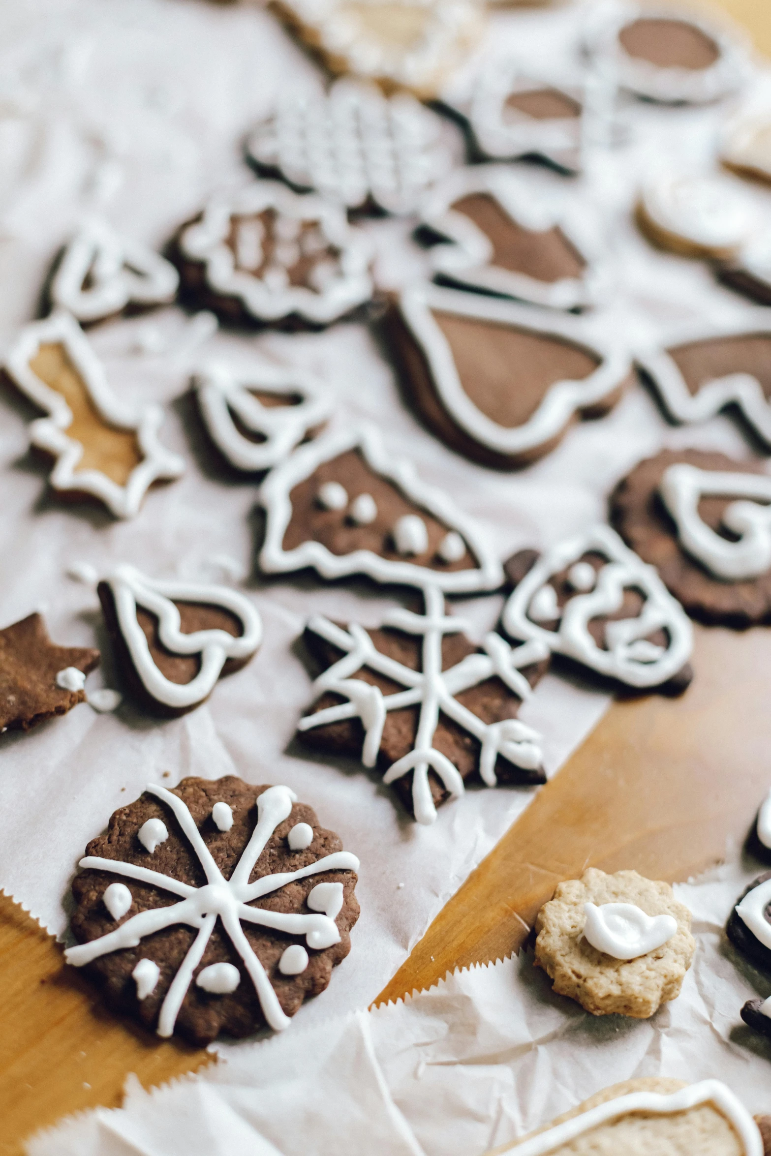 a table topped with lots of cookies covered in icing, pexels, folk art, parchment paper, thumbnail, mid shot photo, 6