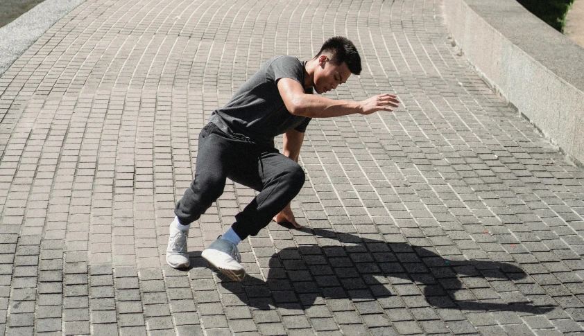 a man is doing a trick on a skateboard, pexels contest winner, in the style of sifu 🔥 😎 🕹️ 👀 :2, dynamic active running pose, christopher cao, on ground