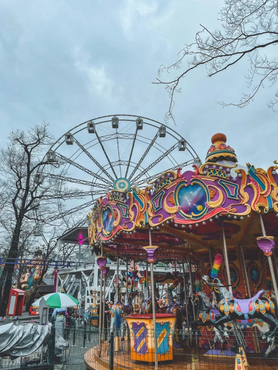 a carousel in a park with a ferris wheel in the background, by Julia Pishtar, pexels contest winner, maximalism, 🎀 🧟 🍓 🧚, winter, colorful]”, grey