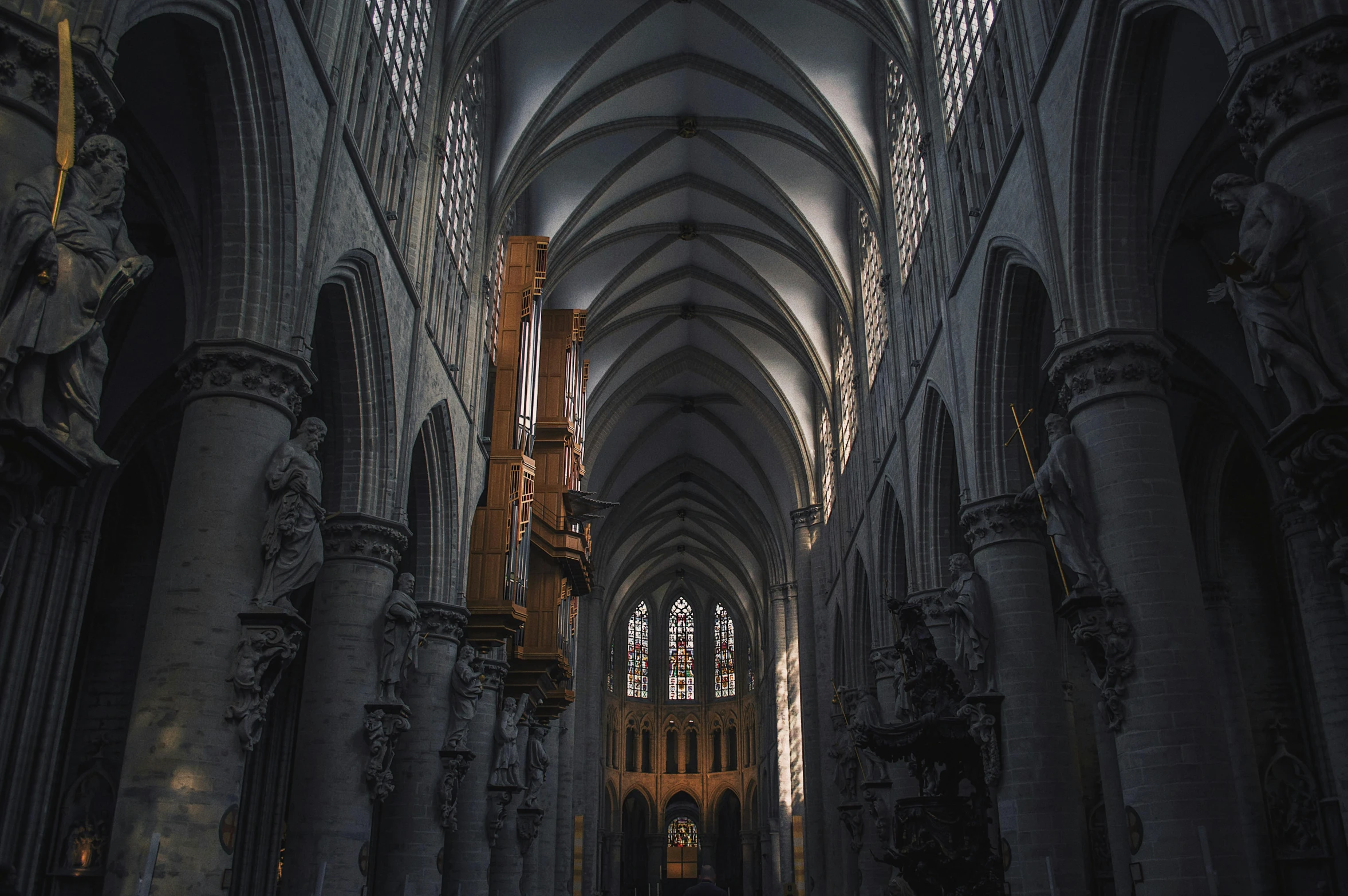 a cathedral with a pipe organ in the middle of it, inspired by Barthélemy d'Eyck, pexels contest winner, grey, belgium, liminal space aesthetic, high arches