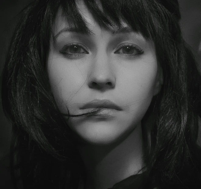 a black and white photo of a woman with long hair, a black and white photo, trending on cgsociety, hyperrealism, black hair and white bangs, beautiful caitriona balfe, alternate album cover, looks like christina ricci