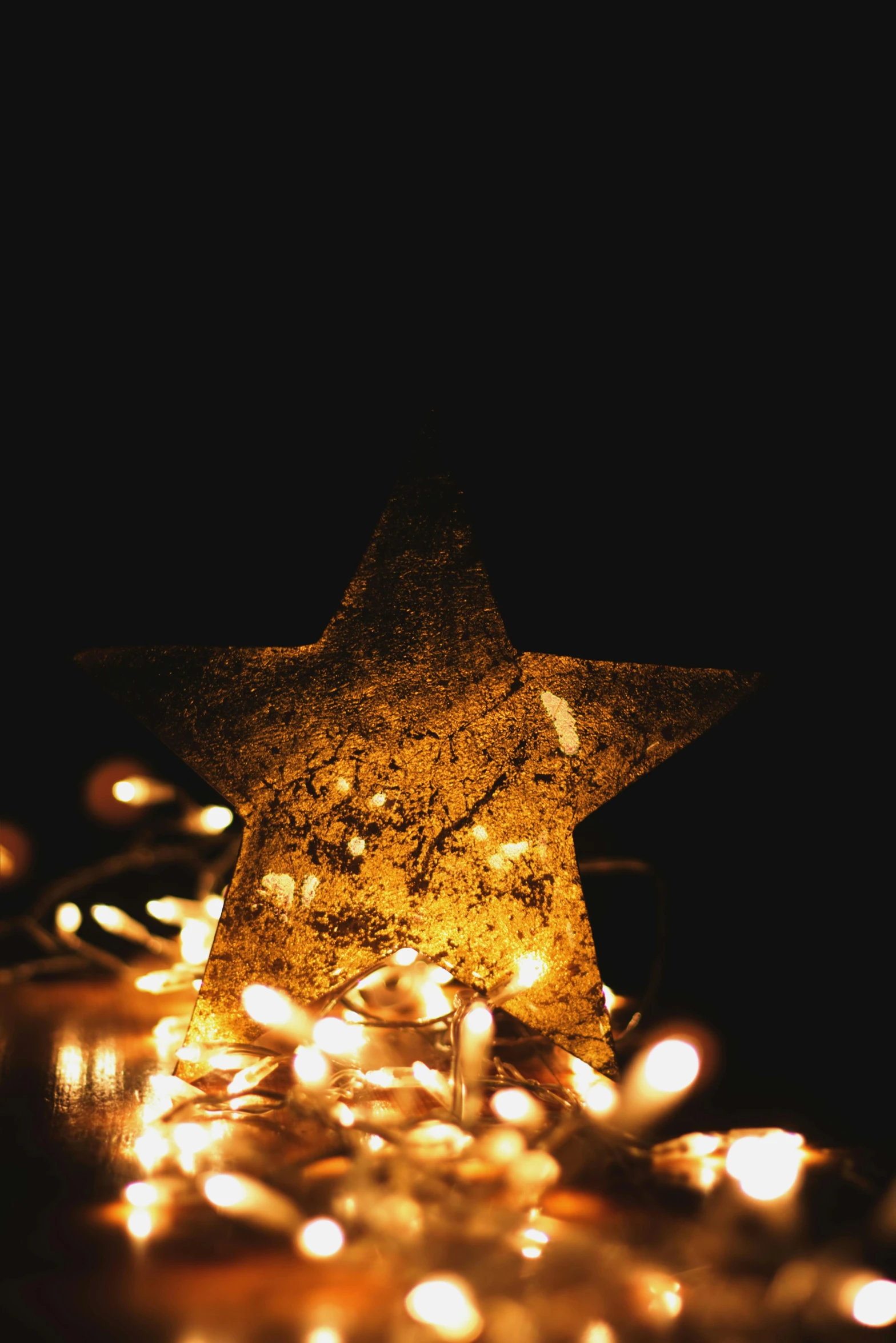 a lighted star sitting on top of a table, pexels, detailed ornaments, profile image, photo mid shot