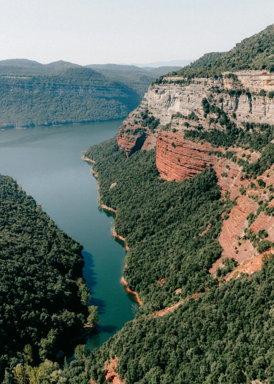 a large body of water surrounded by mountains, oklahoma, steep cliffs, erosion algorithm landscape, 2019 trending photo