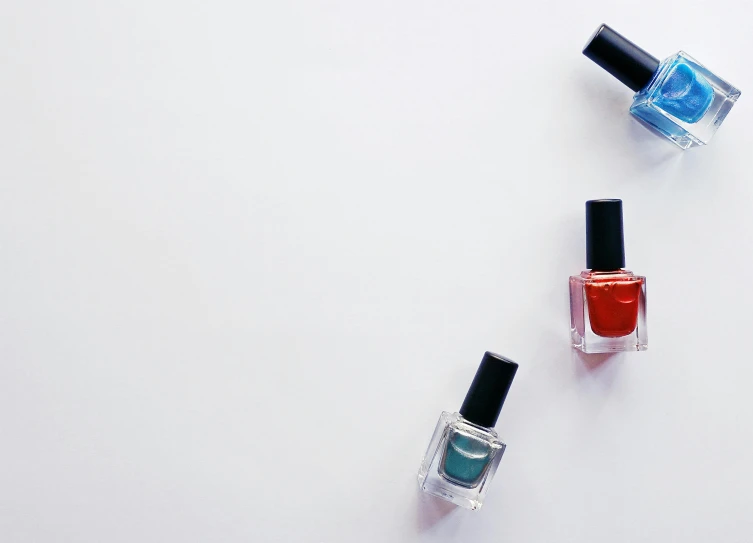 three bottles of nail polish on a white surface, by Gavin Hamilton, unsplash, minimalism, square, fan favorite, blue and red, thumbnail