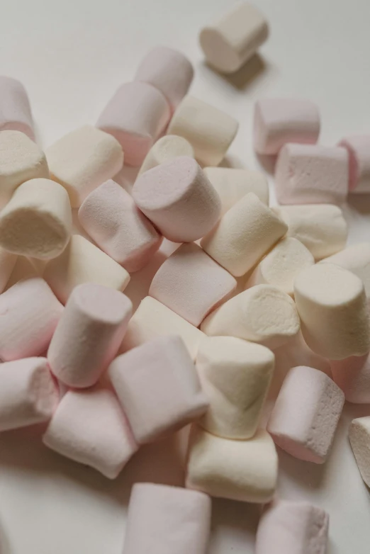 a pile of marshmallows sitting on top of a table, faded pink, subtle detailing, highly upvoted, round corners