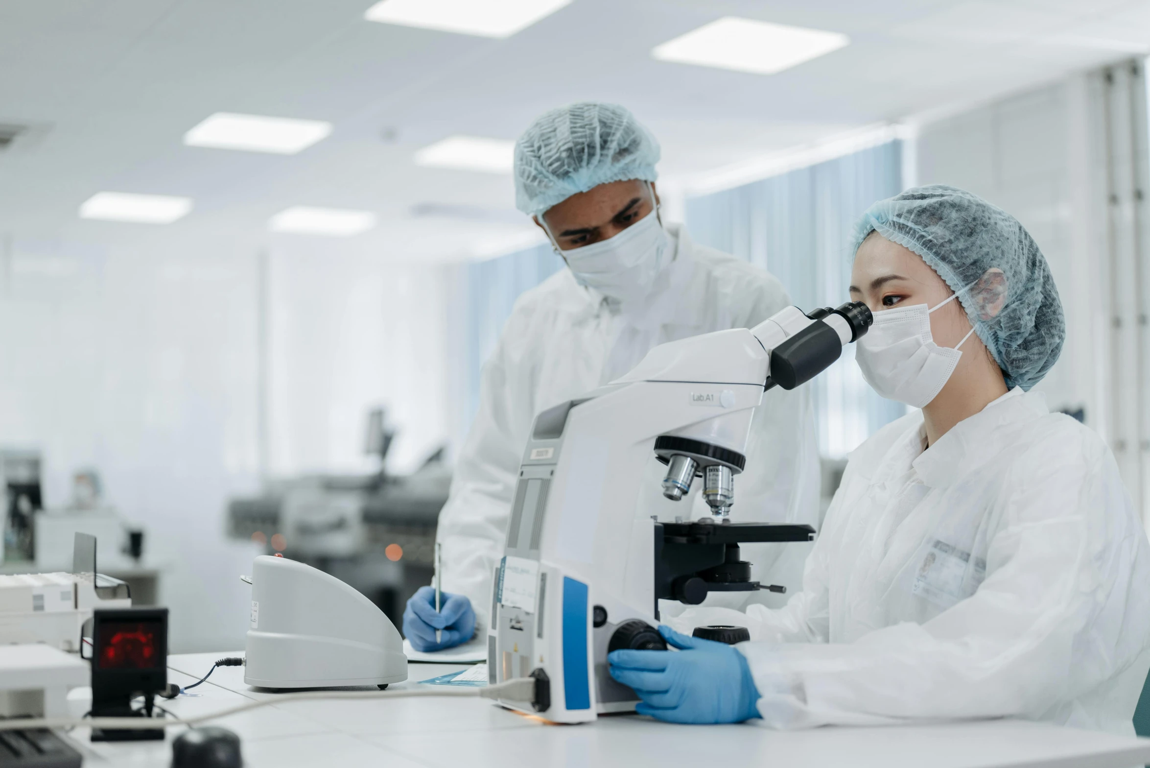 a couple of people that are in a lab, a microscopic photo, shutterstock, surgical supplies, wearing a white hospital gown, technological, unedited