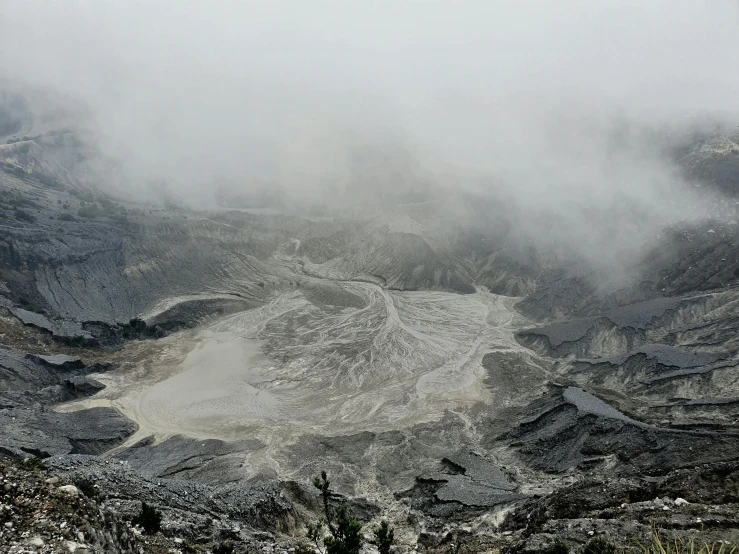 a group of people standing on top of a mountain, by Adam Szentpétery, unsplash contest winner, sumatraism, intricate mine, where the ash gathered, on a gray background, whirlpool