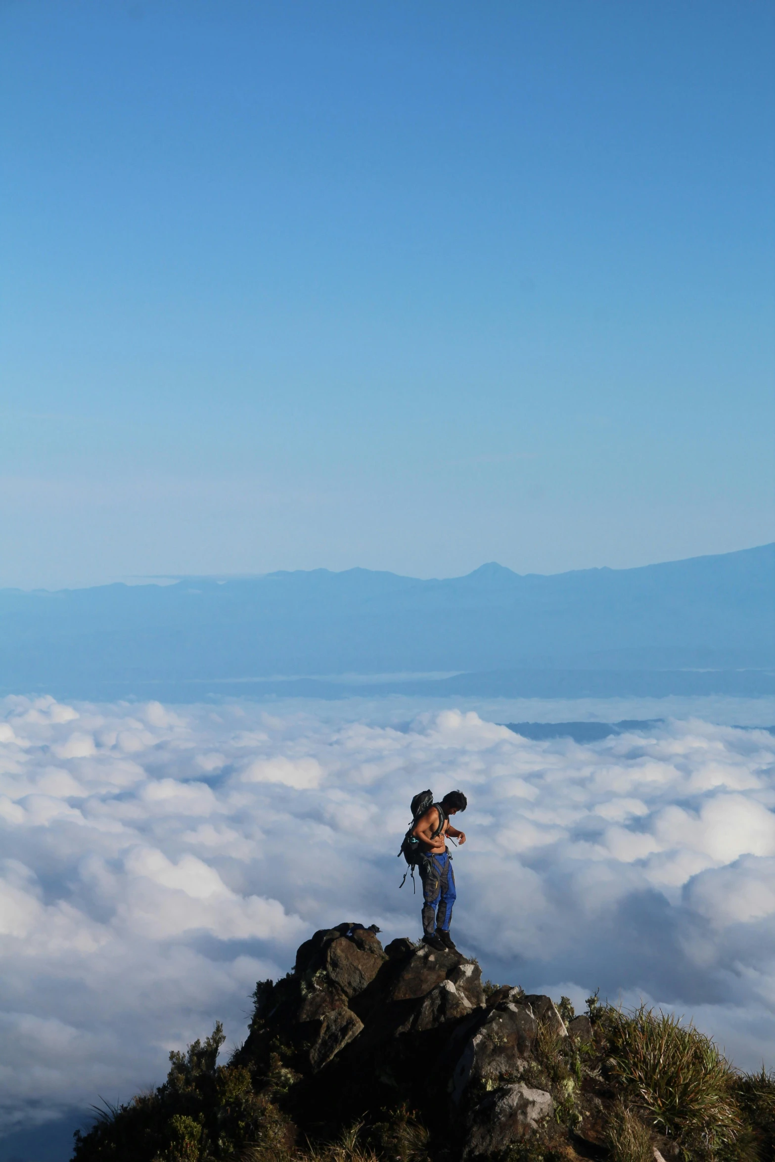 a man standing on top of a mountain above the clouds, by Tadashige Ono, sumatraism, making out, slide show, maui, 8 k -