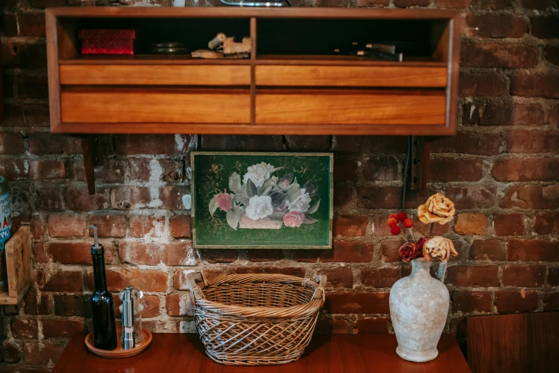 a white vase sitting on top of a wooden table, a still life, by Gwen Barnard, unsplash, arts and crafts movement, vintage fridge, lots of decoration and furniture, caulfield, background bar